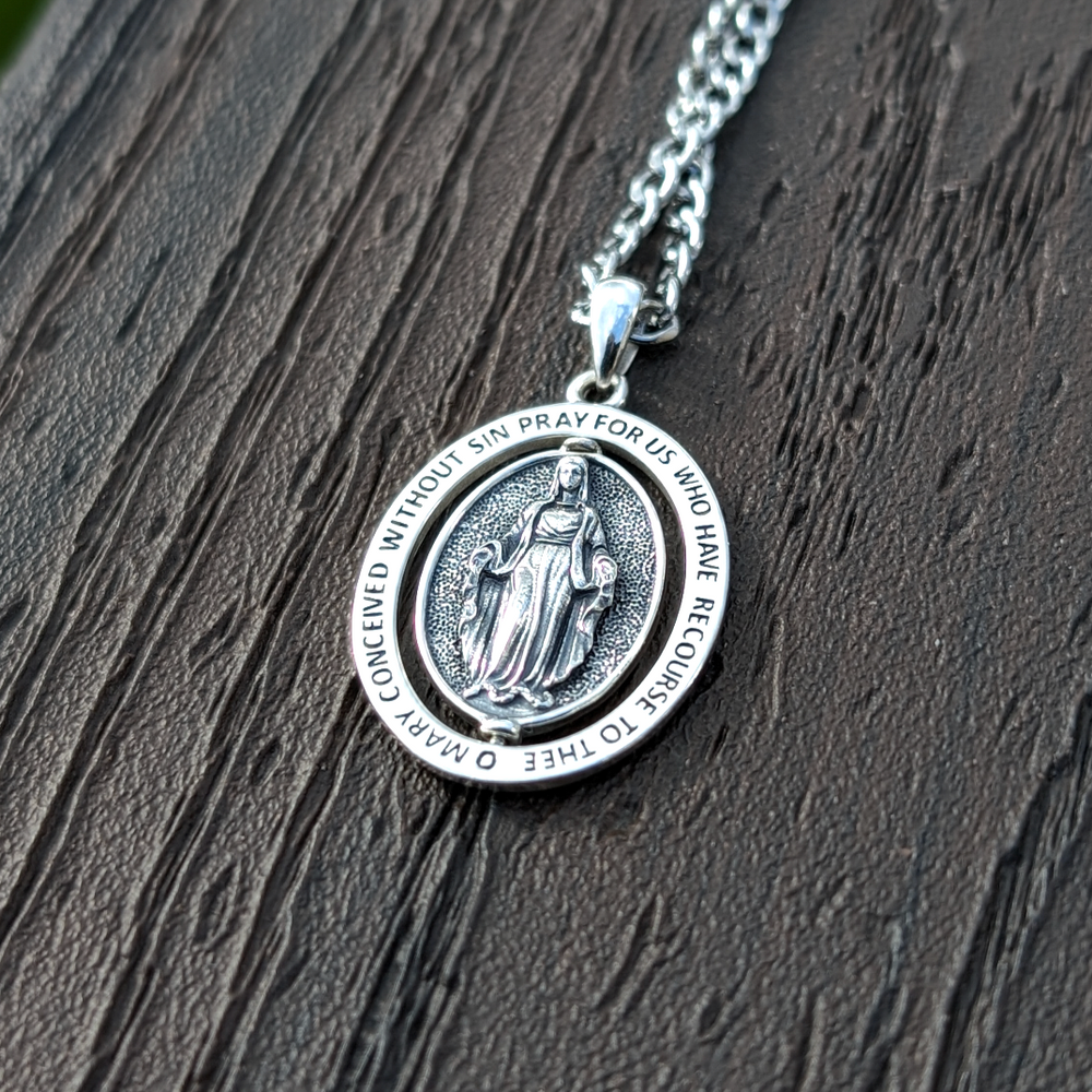 
                      
                        Sterling Silver Rotating Regina Caeli Pendant
                      
                    